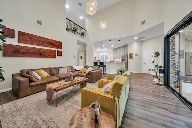 2325 Heather Ridge Dr, Flower Mound, TX 75028 - living room with wood finished floors, baseboards, and visible vents