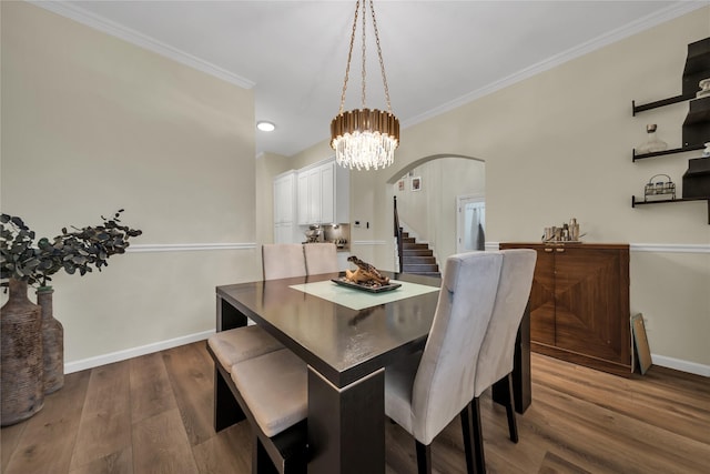 2325 Heather Ridge Dr, Flower Mound, TX 75028 - dining space with baseboards, arched walkways, dark wood finished floors, crown molding, and stairway