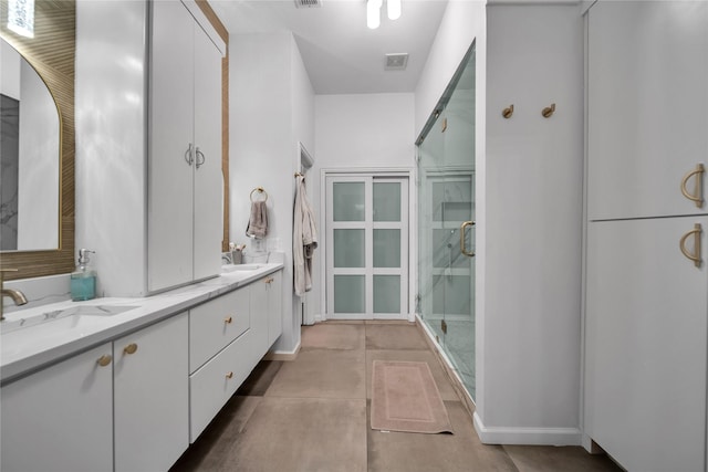 2325 Heather Ridge Dr, Flower Mound, TX 75028 - bathroom featuring a shower stall, double vanity, a sink, and visible vents