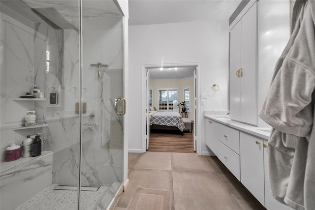 2325 Heather Ridge Dr, Flower Mound, TX 75028 - ensuite bathroom featuring baseboards, a marble finish shower, ensuite bath, and vanity