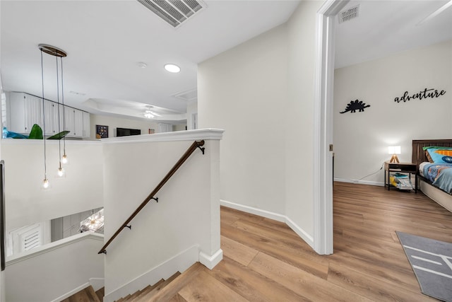 2325 Heather Ridge Dr, Flower Mound, TX 75028 - staircase featuring wood finished floors, baseboards, and visible vents