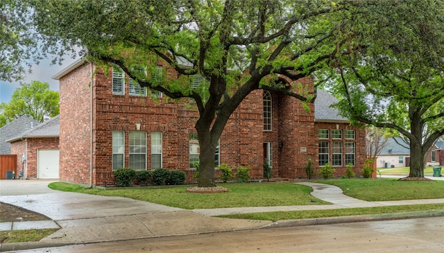 2325 Heather Ridge Dr, Flower Mound, TX 75028 - traditional-style home with concrete driveway, a front yard, and brick siding