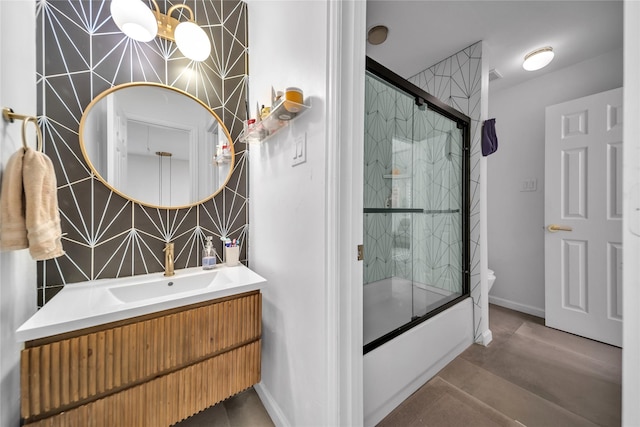2325 Heather Ridge Dr, Flower Mound, TX 75028 - full bathroom with visible vents, baseboards, toilet, vanity, and shower / bath combination with glass door