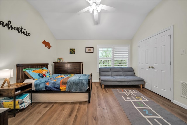 2325 Heather Ridge Dr, Flower Mound, TX 75028 - bedroom with baseboards, a closet, a ceiling fan, lofted ceiling, and wood finished floors