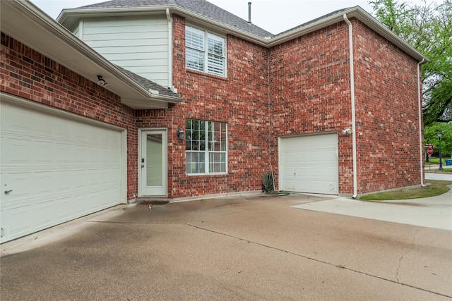 2325 Heather Ridge Dr, Flower Mound, TX 75028 - exterior space featuring concrete driveway, roof with shingles, and brick siding