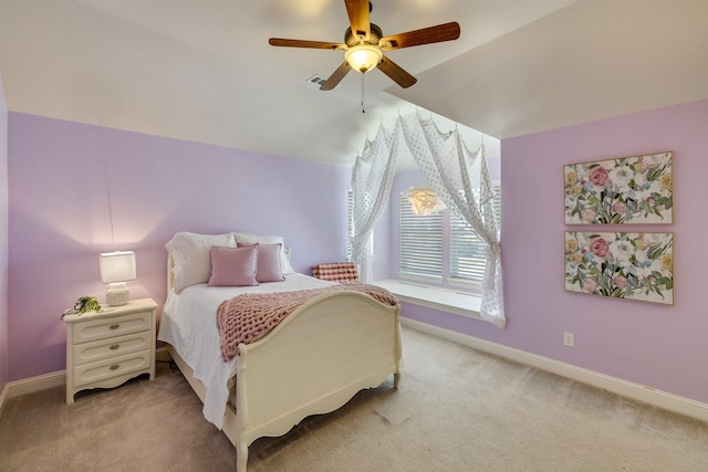 bedroom featuring baseboards, ceiling fan, light colored carpet, and lofted ceiling