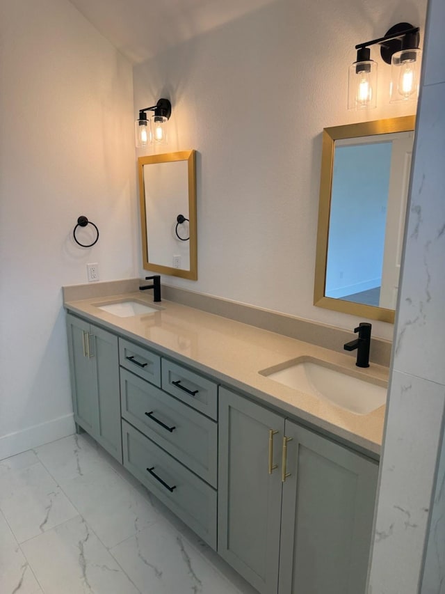 608 N Mill St, Weatherford, TX 76086 - bathroom with double vanity, marble finish floors, and baseboards
