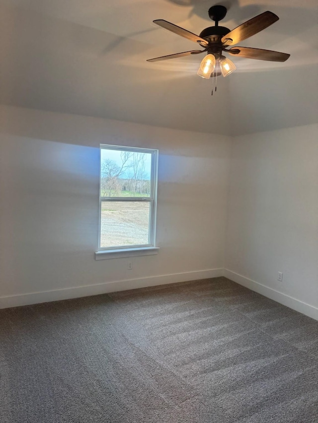 unfurnished room featuring baseboards, a ceiling fan, wood finished floors, and lofted ceiling