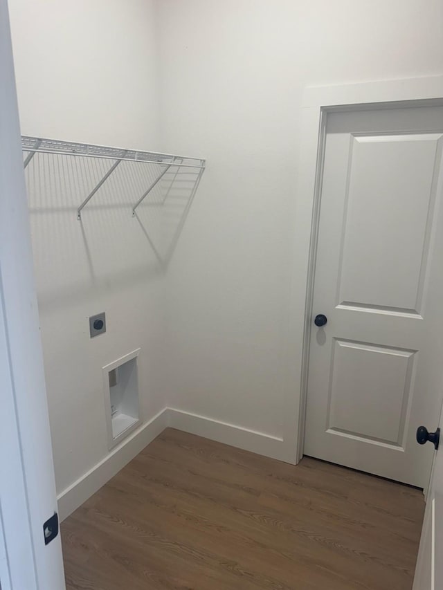 608 N Mill St, Weatherford, TX 76086 - laundry area with hookup for an electric dryer, wood finished floors, and baseboards