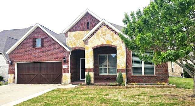 view of front of house featuring concrete driveway, a front yard, brick siding, and stone siding