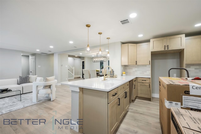 11006 Ferndale Rd, Dallas, TX 75238 - kitchen featuring visible vents, a sink, open floor plan, light wood finished floors, and recessed lighting