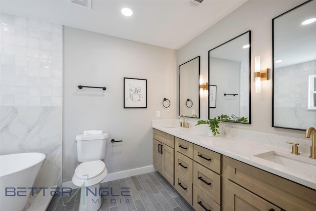 11006 Ferndale Rd, Dallas, TX 75238 - full bathroom with a sink, a freestanding bath, toilet, and double vanity