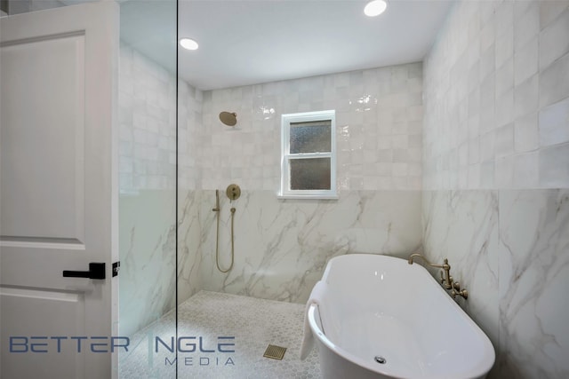 11006 Ferndale Rd, Dallas, TX 75238 - full bath featuring a walk in shower, tile walls, a freestanding tub, and recessed lighting
