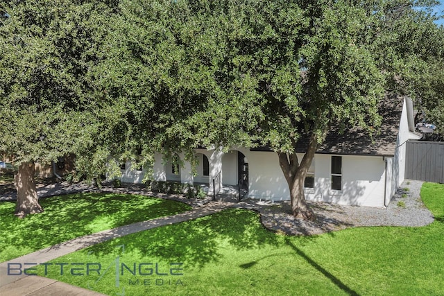 11006 Ferndale Rd, Dallas, TX 75238 - view of property hidden behind natural elements with a porch, a front yard, and fence