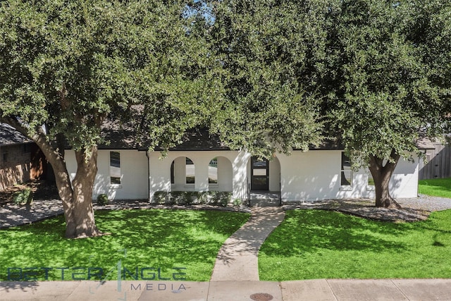 11006 Ferndale Rd, Dallas, TX 75238 - view of property hidden behind natural elements with brick siding, fence, and a front lawn