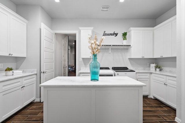5685 Florance Rd, Northlake, TX 76247 - laundry area with cabinet space, separate washer and dryer, wood finish floors, and recessed lighting