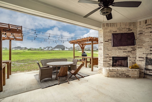 5685 Florance Rd, Northlake, TX 76247 - view of patio with a pergola, an outdoor brick fireplace, outdoor dining area, and a ceiling fan