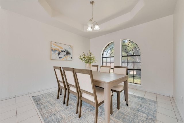820 Craig Dr, Mesquite, TX 75181 - dining space with a chandelier, light tile patterned floors, a raised ceiling, and baseboards