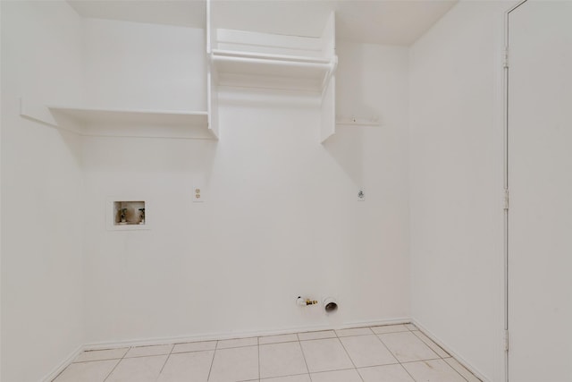 820 Craig Dr, Mesquite, TX 75181 - laundry room featuring hookup for a gas dryer, hookup for a washing machine, baseboards, and light tile patterned flooring