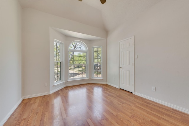 820 Craig Dr, Mesquite, TX 75181 - empty room with light wood-type flooring, ceiling fan, baseboards, and lofted ceiling