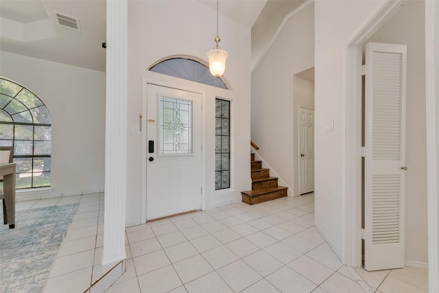 820 Craig Dr, Mesquite, TX 75181 - entrance foyer featuring lofted ceiling, light tile patterned flooring, and stairway