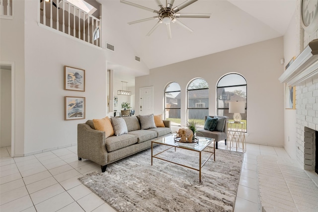 820 Craig Dr, Mesquite, TX 75181 - living area with high vaulted ceiling, light tile patterned floors, a ceiling fan, and a fireplace
