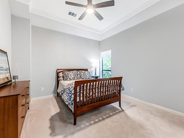 bedroom featuring baseboards, ornamental molding, carpet flooring, and visible vents