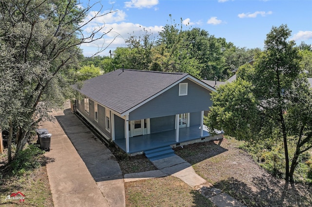view of front of property with a porch and a shingled roof