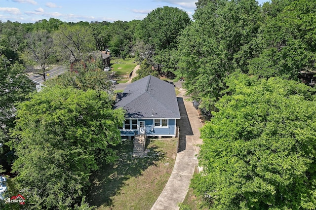 aerial view featuring a wooded view