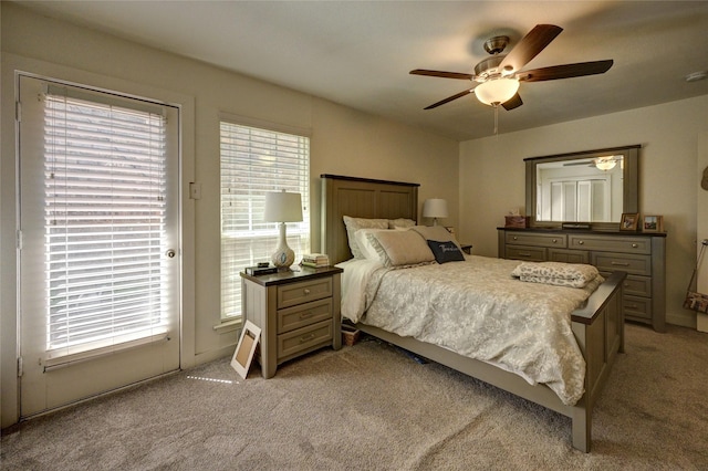2109 Windy Dr, Garland, TX 75044 - bedroom featuring access to outside, light colored carpet, and a ceiling fan