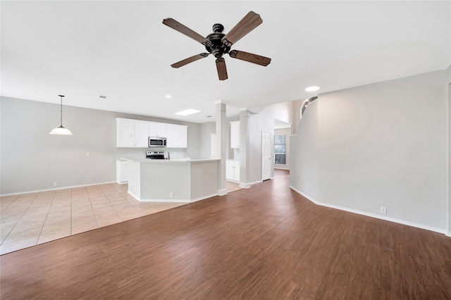 8625 Luzerne Dr, Mckinney, TX 75072 - unfurnished living room featuring recessed lighting, baseboards, a ceiling fan, and light wood-style floors