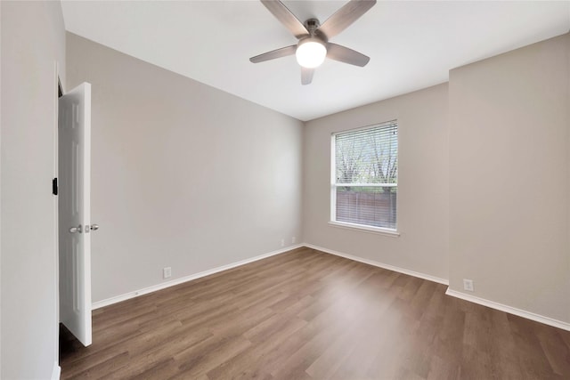 8625 Luzerne Dr, Mckinney, TX 75072 - spare room featuring wood finished floors, baseboards, and a ceiling fan