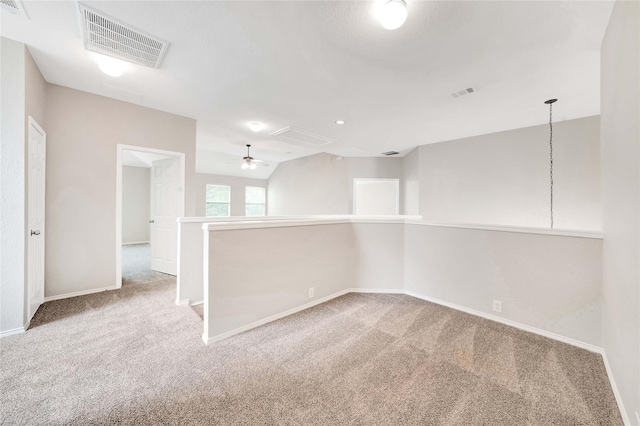 8625 Luzerne Dr, Mckinney, TX 75072 - carpeted spare room featuring vaulted ceiling, visible vents, baseboards, and attic access