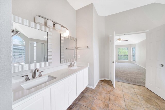 8625 Luzerne Dr, Mckinney, TX 75072 - bathroom with a shower with shower door, double vanity, a sink, and a ceiling fan