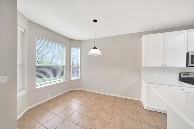 8625 Luzerne Dr, Mckinney, TX 75072 - unfurnished dining area featuring light tile patterned floors and baseboards