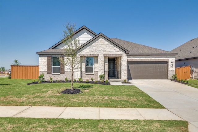 4031 Bedford Dr, Crandall, TX 75114 - view of front facade with an attached garage, stone siding, a front yard, and concrete driveway