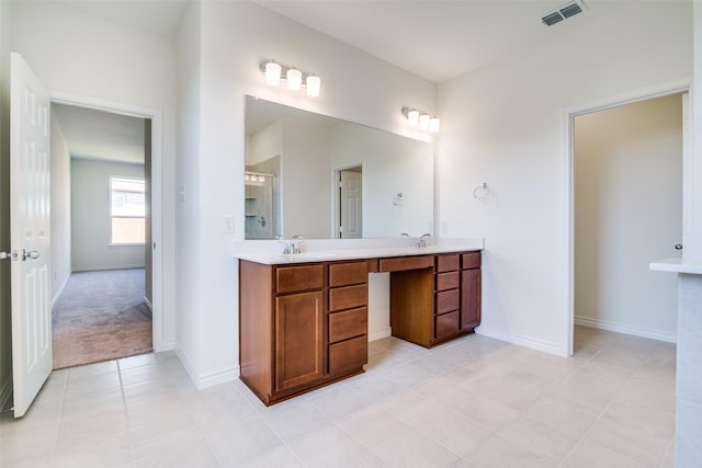 4031 Bedford Dr, Crandall, TX 75114 - bathroom featuring tile patterned floors, double vanity, visible vents, a sink, and a stall shower
