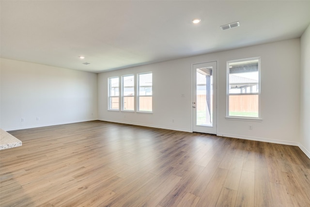 4031 Bedford Dr, Crandall, TX 75114 - unfurnished living room with baseboards, wood finished floors, visible vents, and recessed lighting