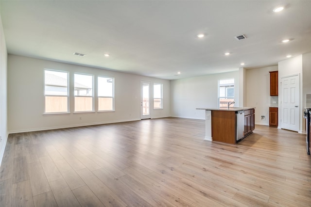4031 Bedford Dr, Crandall, TX 75114 - unfurnished living room with light wood finished floors, baseboards, visible vents, and recessed lighting