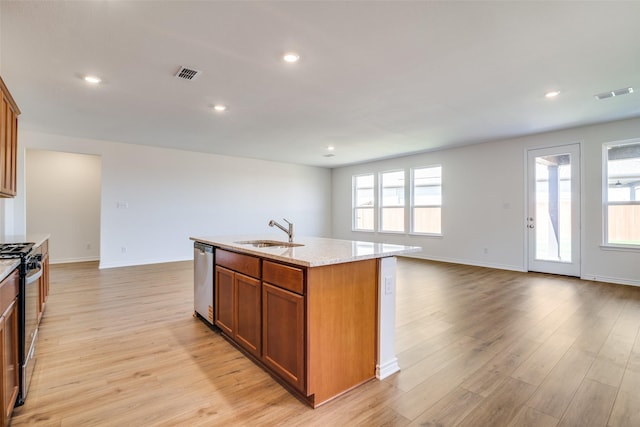 4031 Bedford Dr, Crandall, TX 75114 - kitchen with light wood finished floors, visible vents, gas stove, and a sink