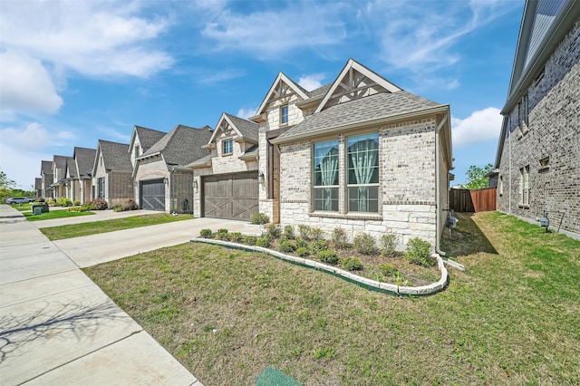 4729 Brockwell Dr, Carrollton, TX 75010 - view of front of house featuring a residential view, a front lawn, brick siding, a shingled roof, and driveway
