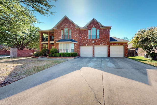 104 Bayonne Dr, Mansfield, TX 76063 - traditional home featuring concrete driveway, brick siding, and an attached garage