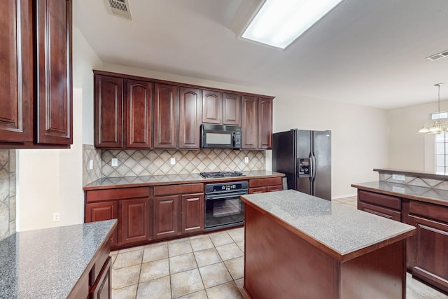 104 Bayonne Dr, Mansfield, TX 76063 - kitchen featuring black appliances, tasteful backsplash, a center island, a chandelier, and decorative light fixtures