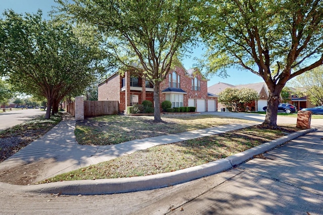 104 Bayonne Dr, Mansfield, TX 76063 - view of front facade featuring an attached garage, concrete driveway, and brick siding