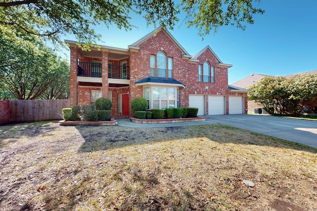 104 Bayonne Dr, Mansfield, TX 76063 - traditional home featuring brick siding, an attached garage, driveway, and a balcony