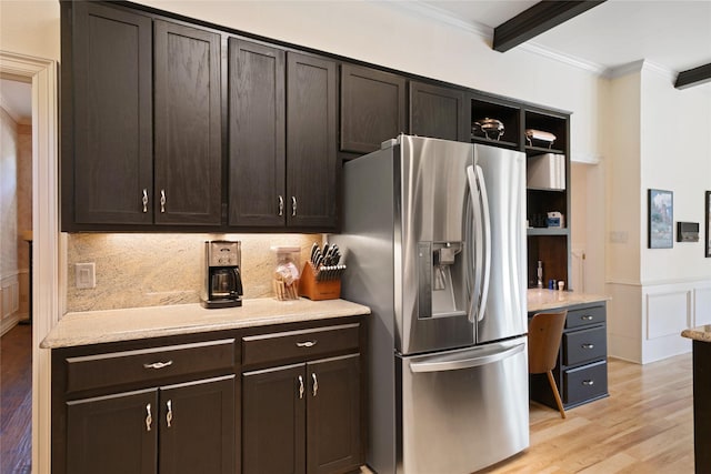 kitchen featuring open shelves, stainless steel refrigerator with ice dispenser, ornamental molding, light wood-type flooring, and decorative backsplash