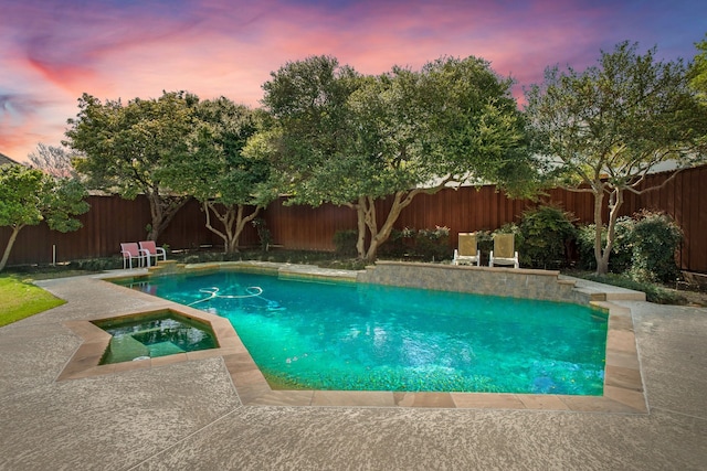 view of swimming pool with a fenced backyard, a fenced in pool, an in ground hot tub, and a patio area