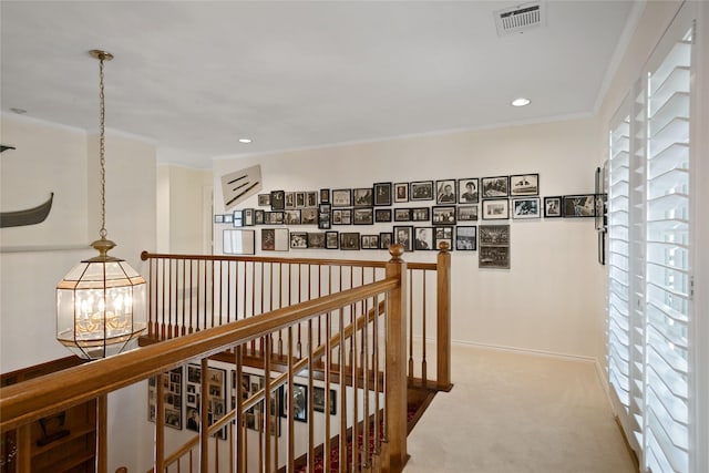 corridor featuring visible vents, baseboards, an upstairs landing, carpet floors, and recessed lighting