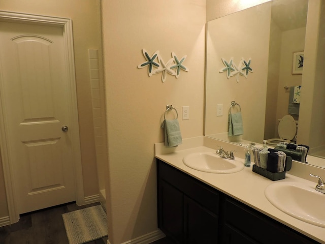 112 Westview Dr, Gun Barrel City, TX 75156 - bathroom featuring double vanity, wood finished floors, and a shower