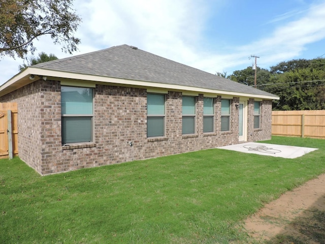112 Westview Dr, Gun Barrel City, TX 75156 - rear view of property featuring a shingled roof, brick siding, and a patio area